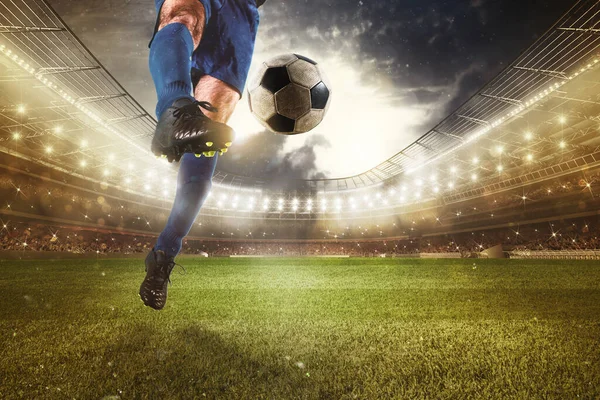 Close up of a striker who kick the ball to make goals at the stadium during a soccer game — Stock fotografie