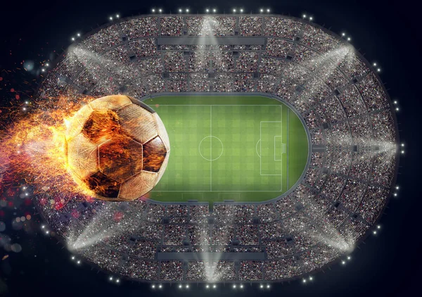 Balón de fútbol con llama de fuego sobre un estadio —  Fotos de Stock