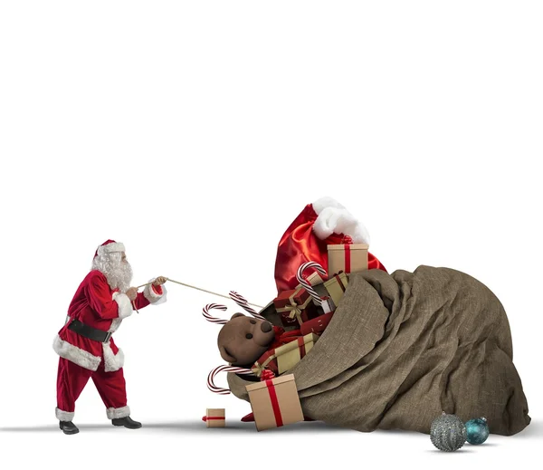 Santa claus pulls gift bag — Stock Photo, Image