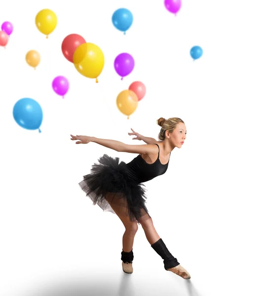 Girl dancing with colorful balloons — Stock Photo, Image