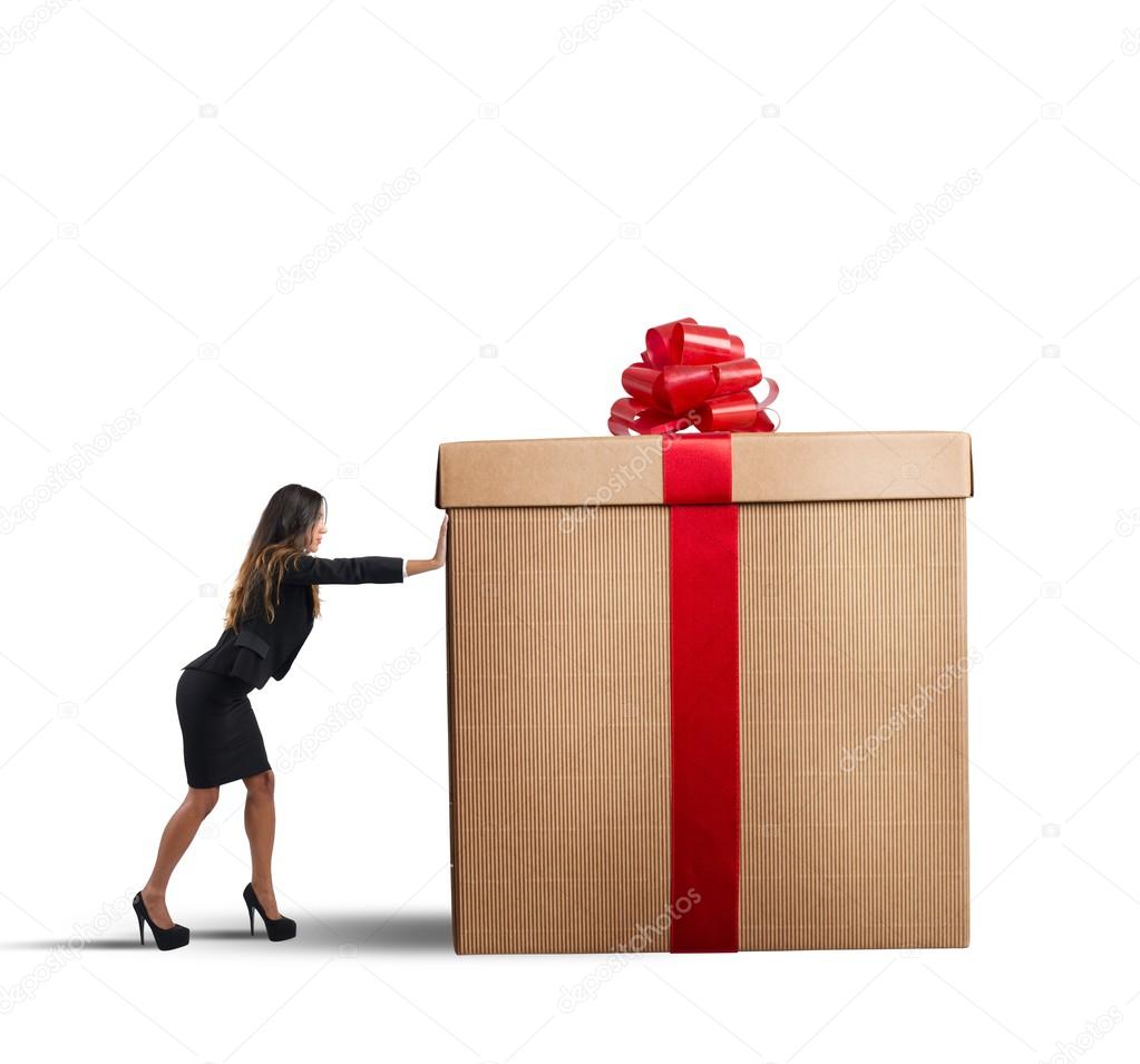 Businesswoman pushing Christmas gift