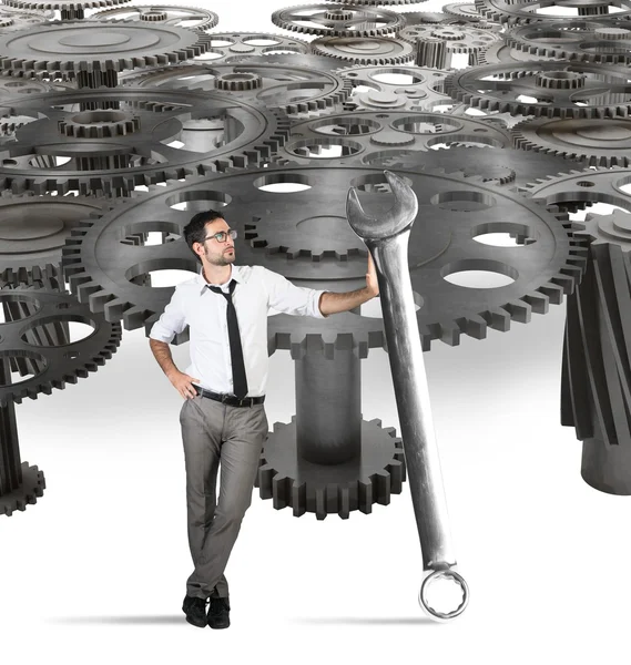 Businessman with big wrench — Stock Photo, Image