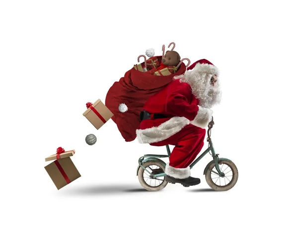 Santaclaus levererar presenter med cykel — Stockfoto