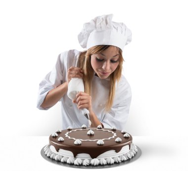 Pastry cook prepares cake clipart