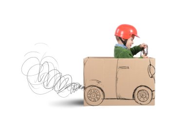 Baby plays with cardboard car
