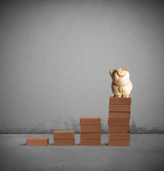 Sparschwein auf Ziegeltreppe — Stockfoto