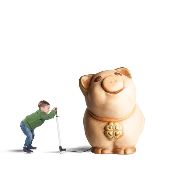 Child inflate his piggy bank — Stock Photo, Image