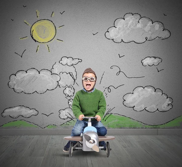 Child plays with car airplane — Stock Photo, Image