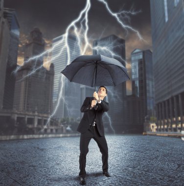 Businessman against thunder and lightning clipart