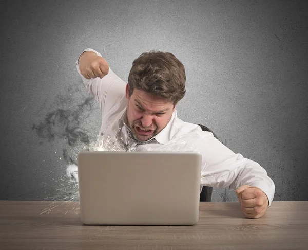 Stressed businessman breaks the computer — Stock Photo, Image