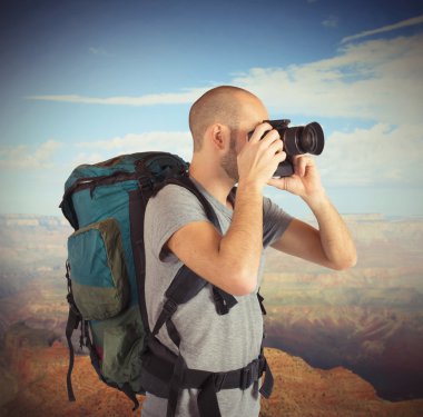 Explorer photographing landscapes clipart