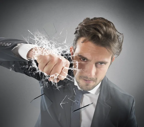 Businessman breaks the glass — Stock Photo, Image