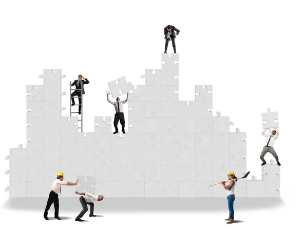 Business team che lavora per la costruzione di puzzle — Foto Stock