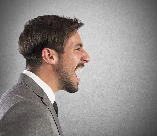 Businessman explodes in a scream — Stock Photo, Image