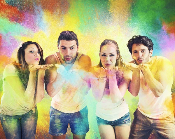 Friends blowing colored powders — Stock Photo, Image