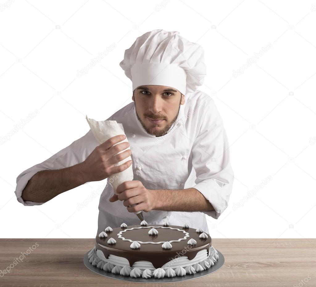 Pastry cook prepares a cake