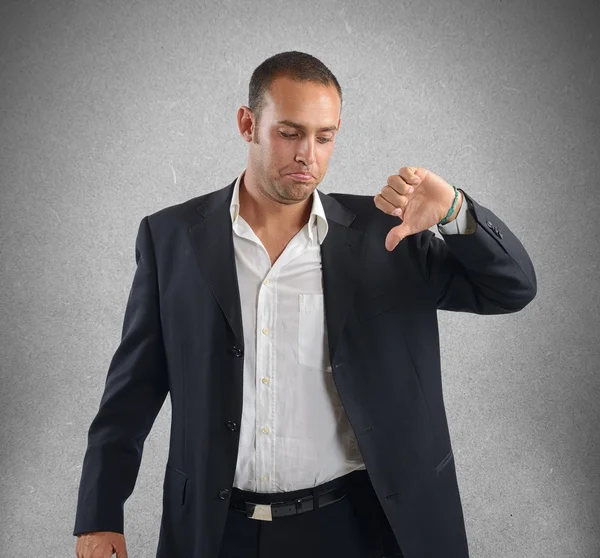 Businessman showing thumb down — Stock Photo, Image