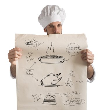 male cook reads his recipes clipart