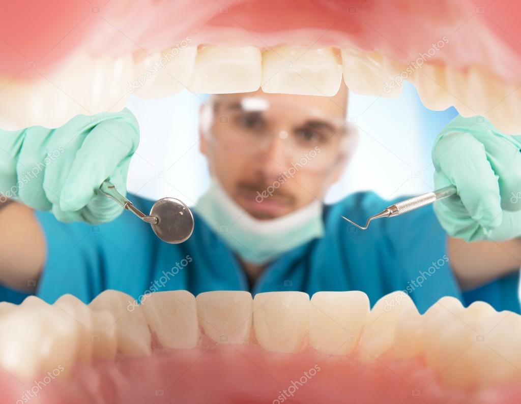 Dentist checks the teeth