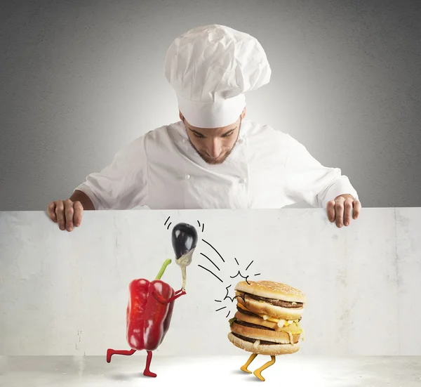 Chef looks at a ironic billboard — Stock Photo, Image