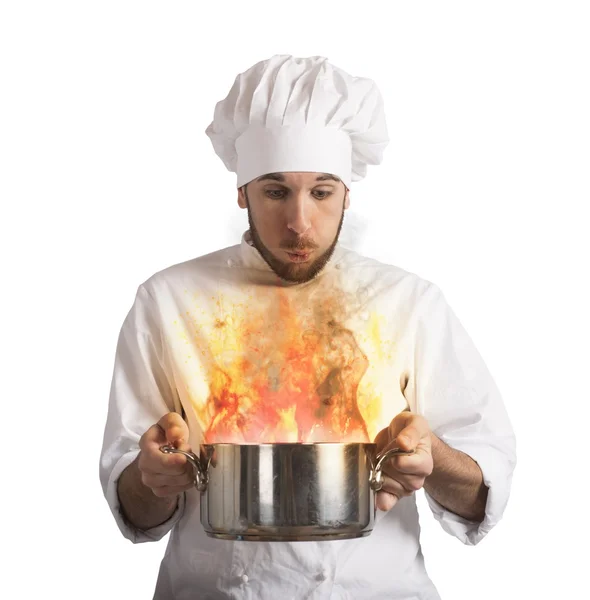 Chef blowing burnt food — Stock Photo, Image