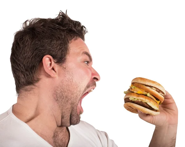 Hungriger Mann isst ein Sandwich — Stockfoto