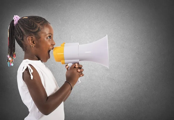 Little girl screaming and shouting with megaphone — Stock Photo, Image