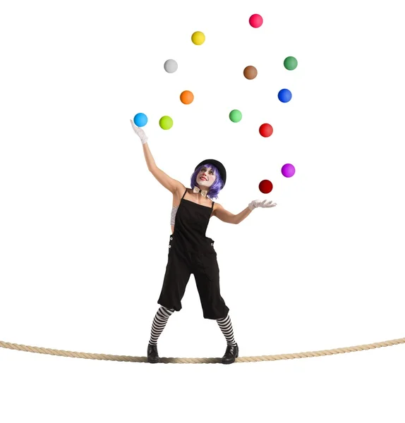 Woman clown balancing on rope — Stock Photo, Image