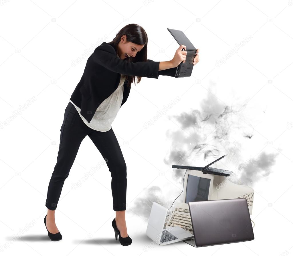 businesswoman attacking computers and laptops