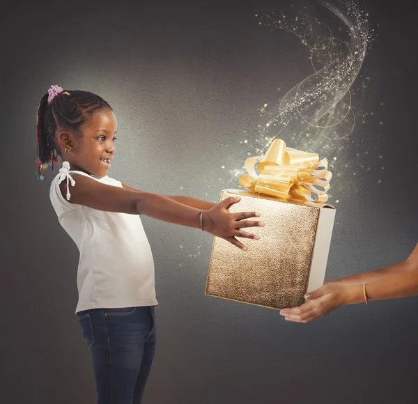 Little girl receives present — Stock Photo, Image