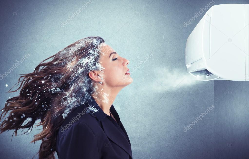 girl under a air conditioner