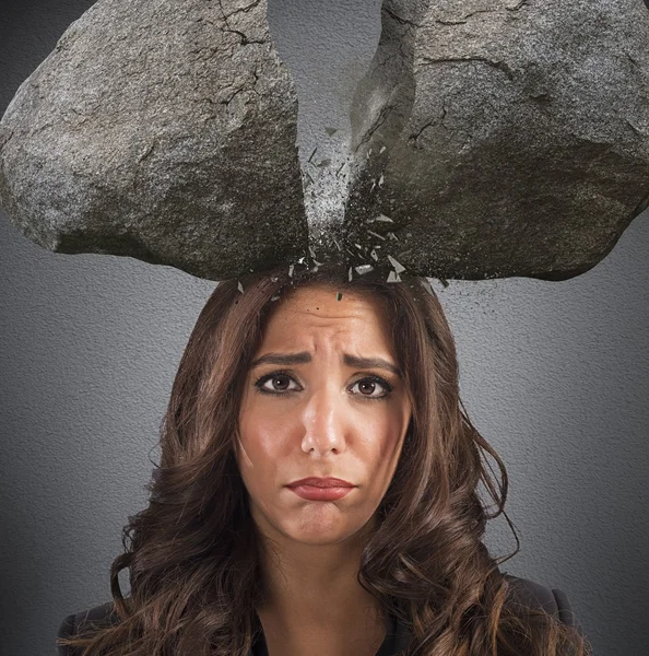 Businesswoman with split boulder — Stock Photo, Image