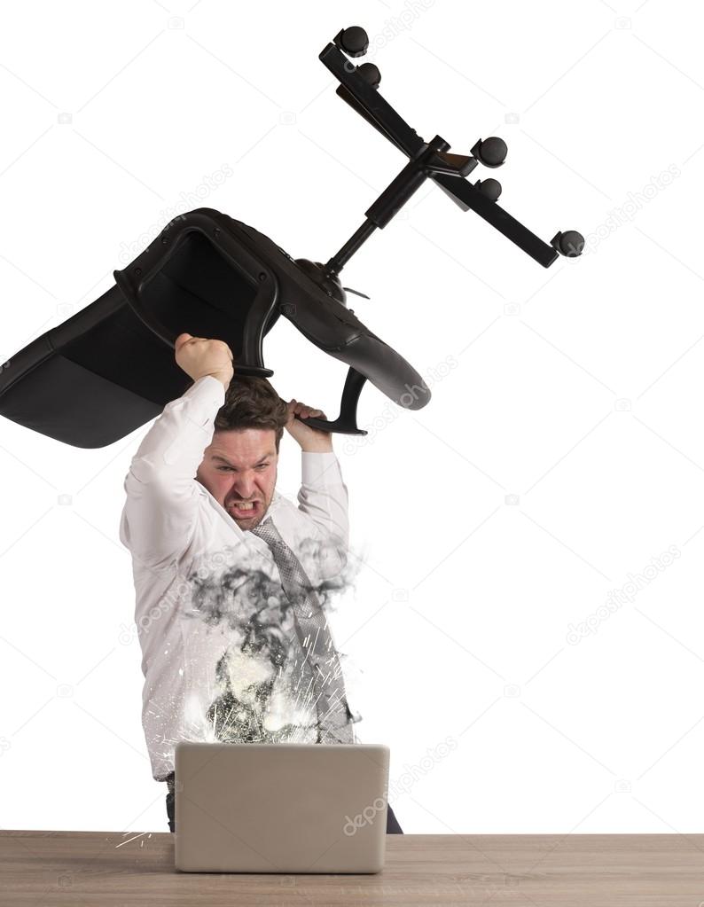 businessman breaks the computer with chair