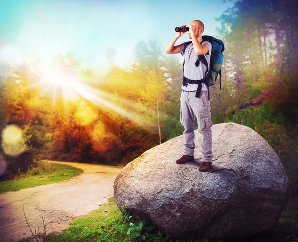 Explorer watching with binoculars — Stock Photo, Image