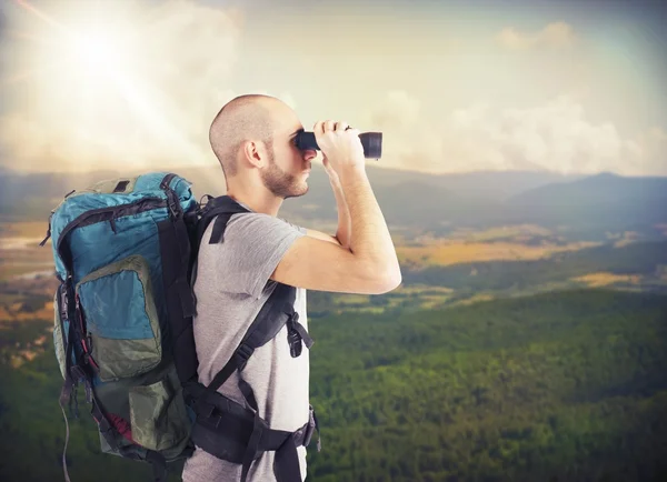 Explorer with backpack and binocular — Stock Photo, Image
