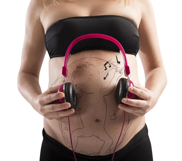 Unborn baby listen to music — Stock Photo, Image