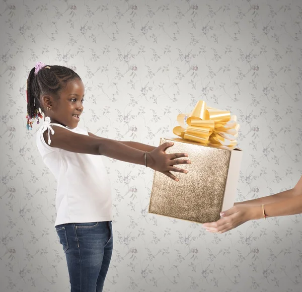 Excited little girl receives an unexpected present — Stock Photo, Image
