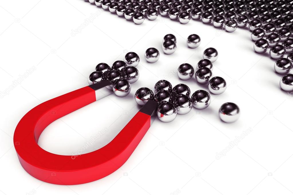 Magnet attracts steel balls  