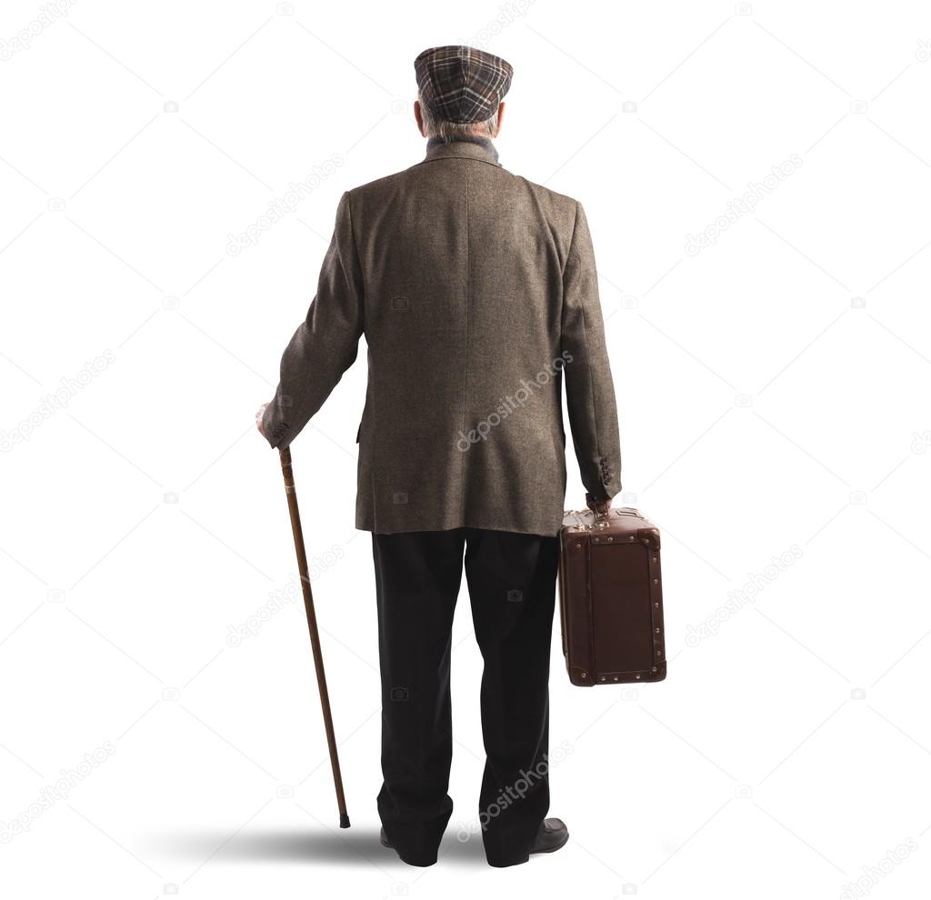 Old man  with suitcase and stick