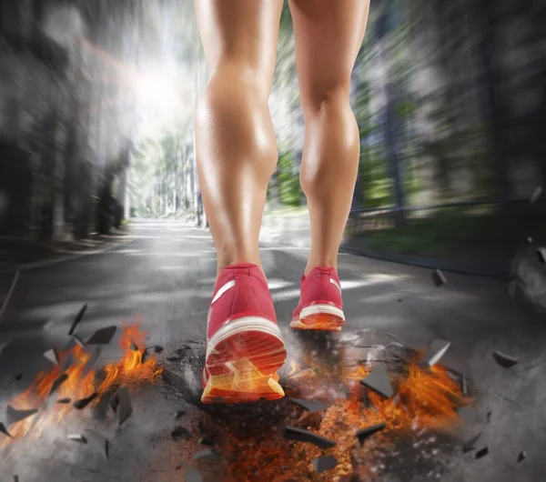 Woman runs leaving a trail of fire — Stock Photo, Image