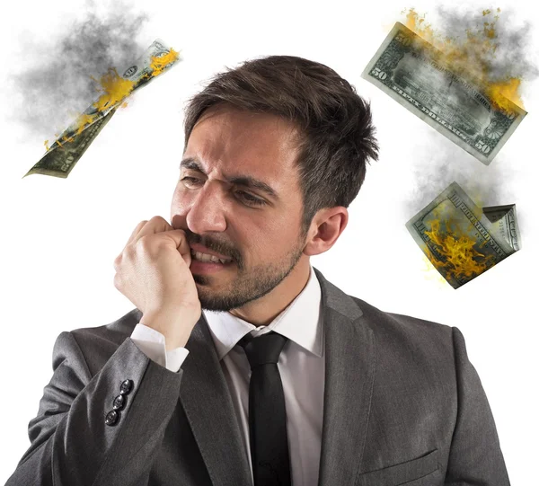 Businessman with money which are flammable — Stock Photo, Image