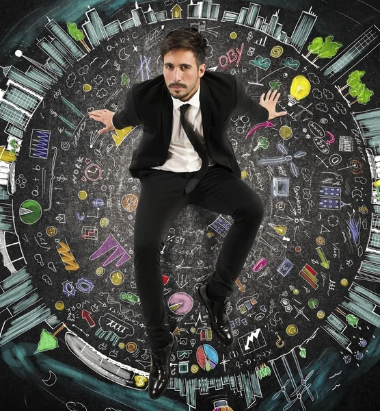 Geschäftsmann sitzt auf einem Kreis von Symbolen — Stockfoto