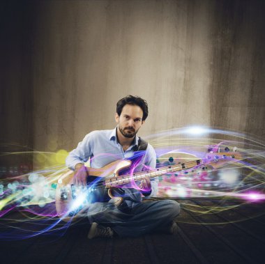 Adam gitarist müzik çalar