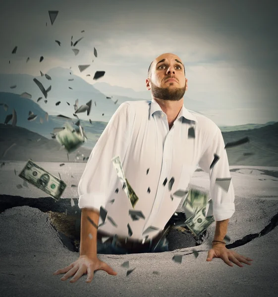 Businessman falls in a break of asphalt — Stock Photo, Image