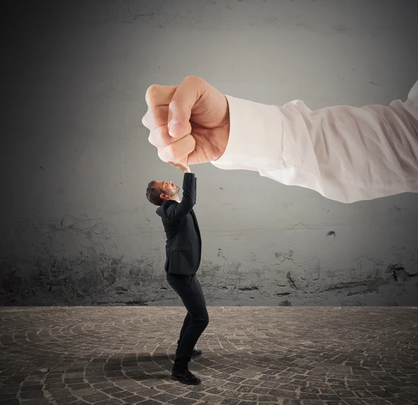 Businessman crushed by a big punch — Stock Photo, Image