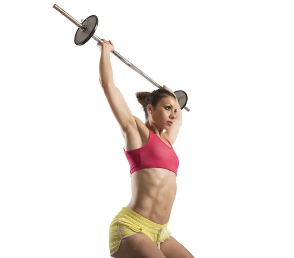 Mujer haciendo ejercicio con barra de pesas — Foto de Stock