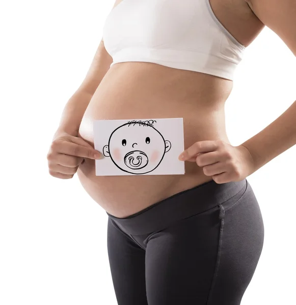 Pregnant woman holds card — Stock Photo, Image