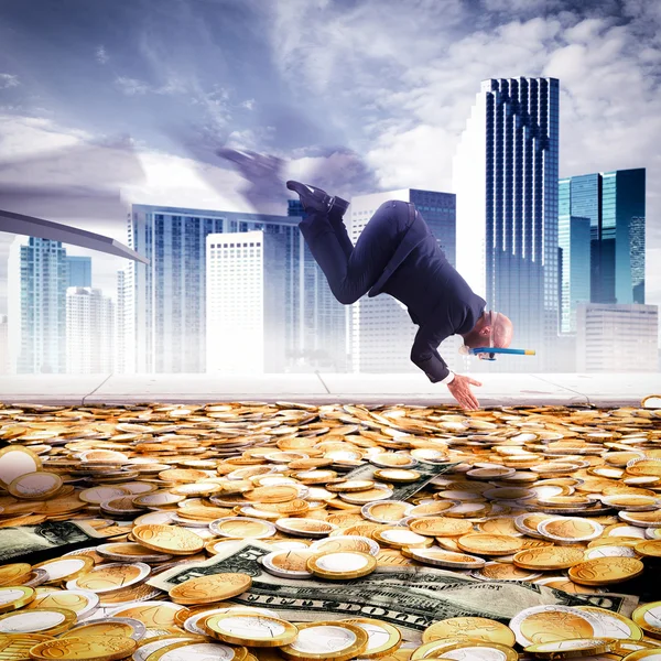 Businessman dives into the pool of money — Stock Photo, Image