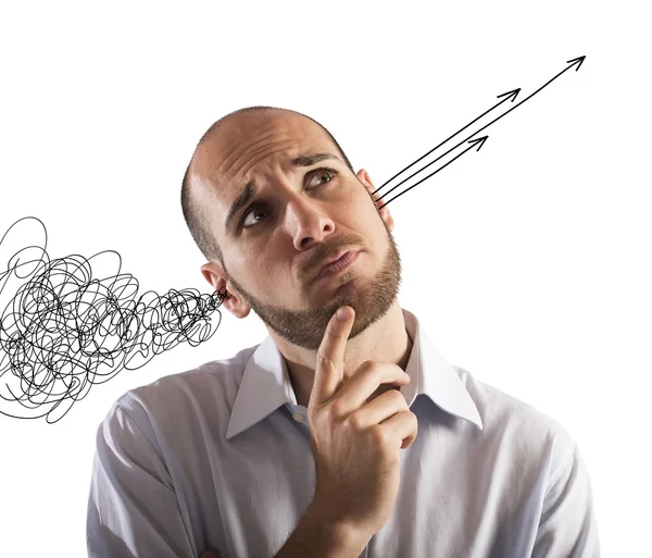 Tangle goes in ear of businessman and out arrows — Stock Photo, Image