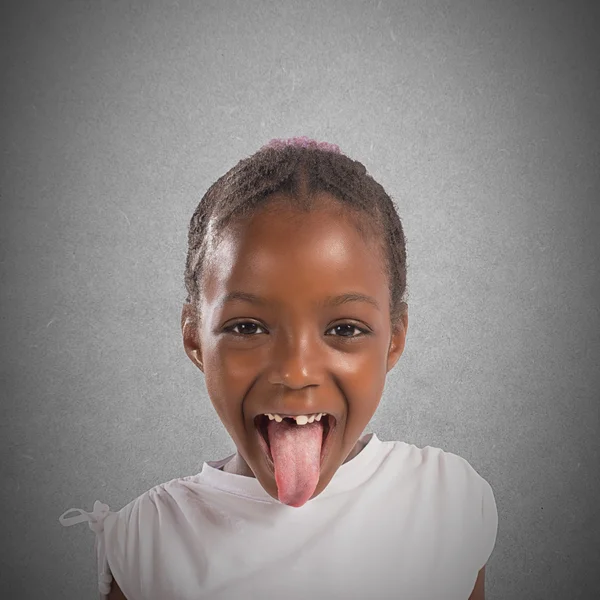 Little girl makes a tongue — Stock Photo, Image